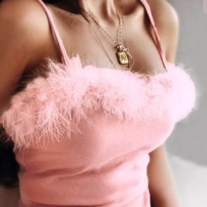 Adriana Grande feather boa bust dress